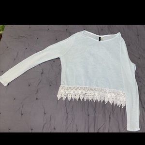 See through baby blue blouse, white lace at bottom